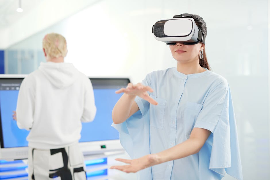 Woman in VR headset interacting in a modern office with tech devices in the background.